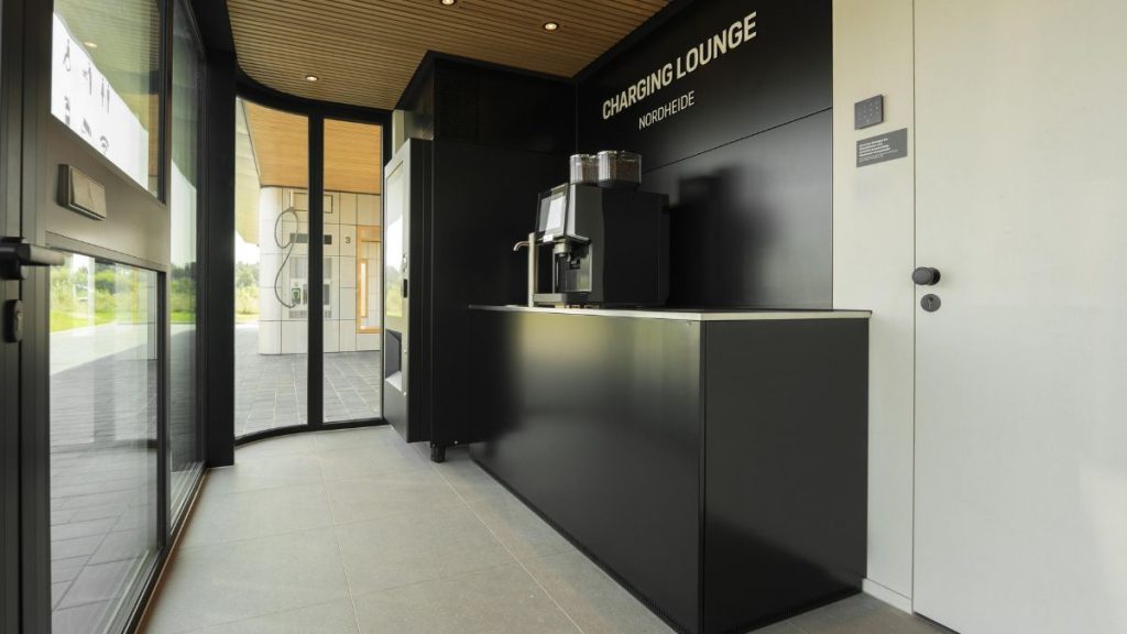 A photo of the indoor facilities. The building is crisp and modern, with glass doors shining light into the building.